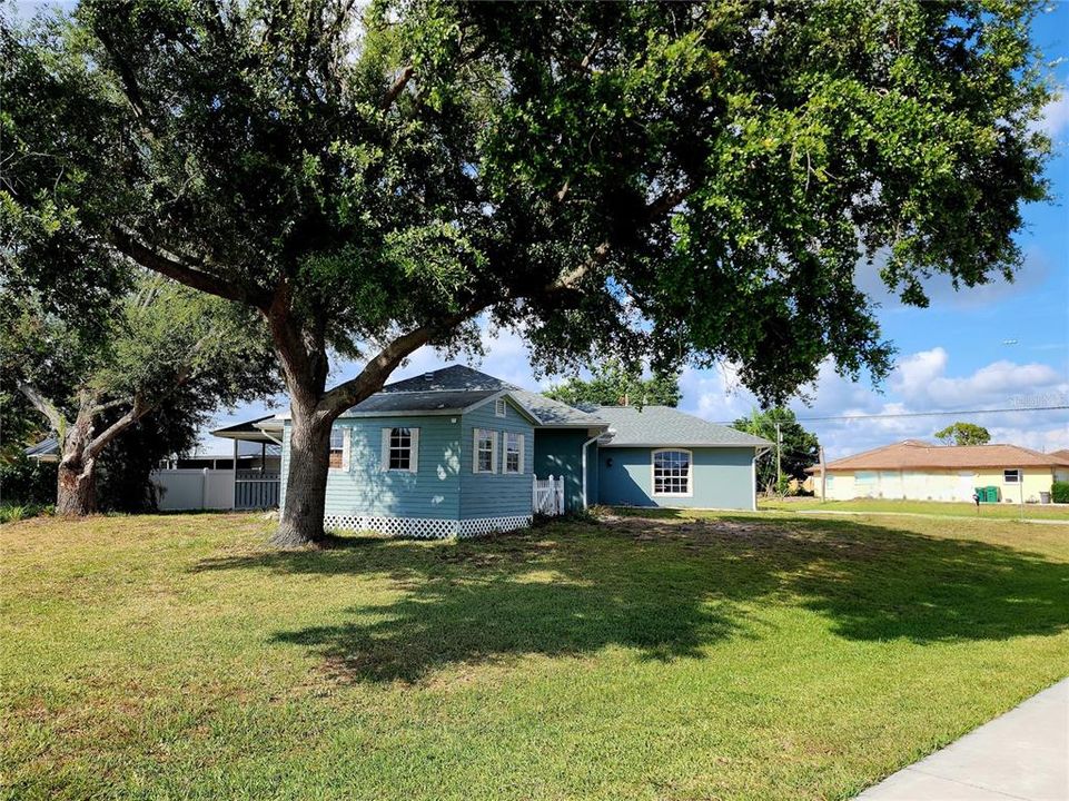 Several mature trees grace this .24 acre lot; storage shed