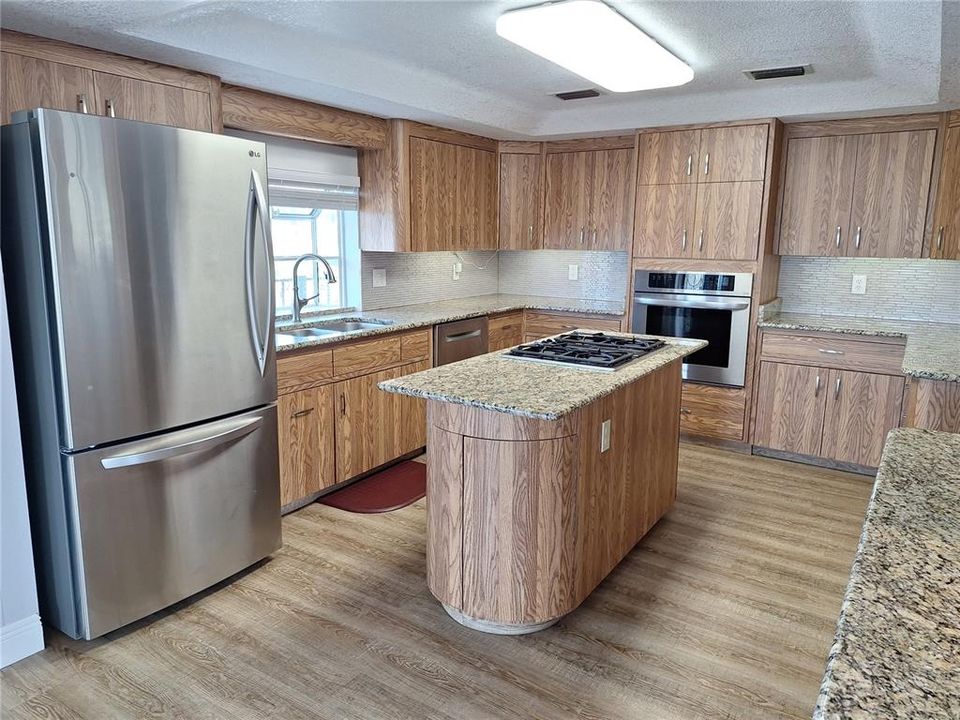 Island has Gas Stove Top, and Garden Window for Herbs