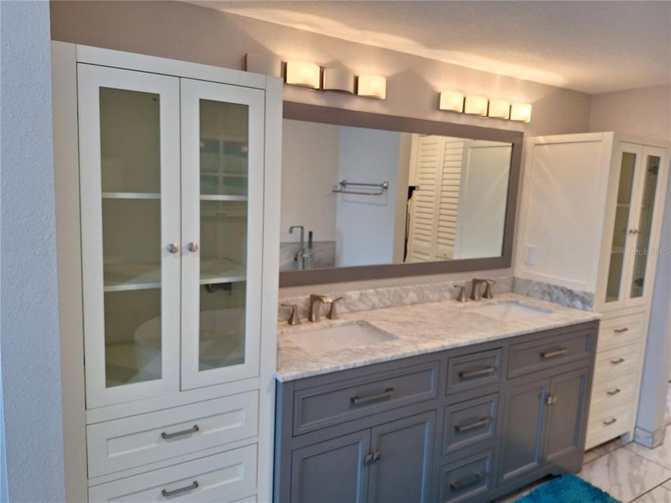 Lots of Bathroom Cabinetry, Granite and Double Sinks