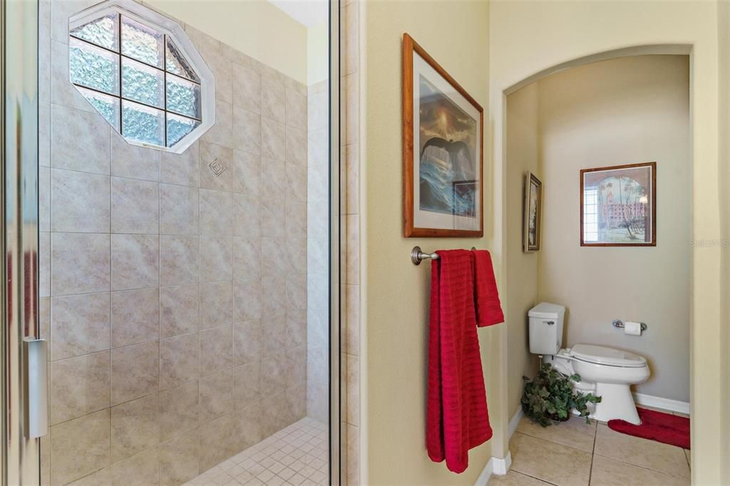Primary Bathroom with Walk-in Shower and Private Water Closet