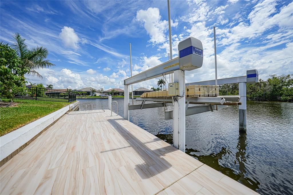 The 140 foot sea wall features a 120 foot tiled dock with 20,000 lb. boat lift.