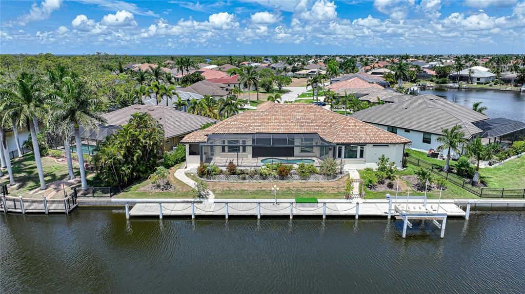 The 140 foot seawall and 120 foot tile dock has a 20,000 lb boat lift and sailboat access to Charlotte Harbor and the Gulf of Mexico.