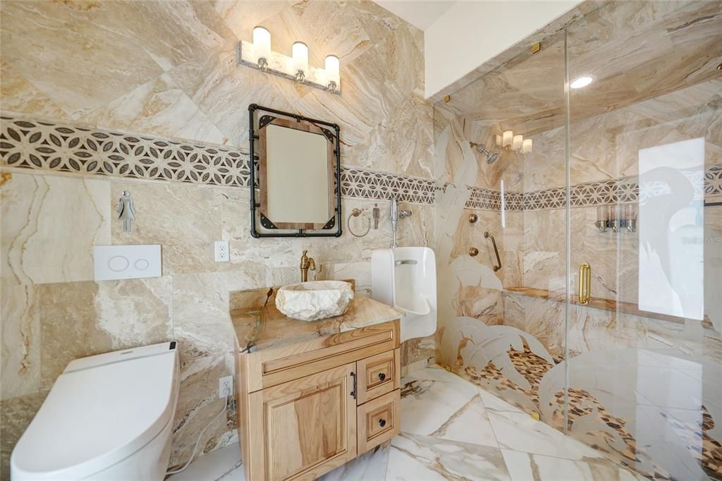 This lovely second en-suite bathroom features a hand-carved sink.