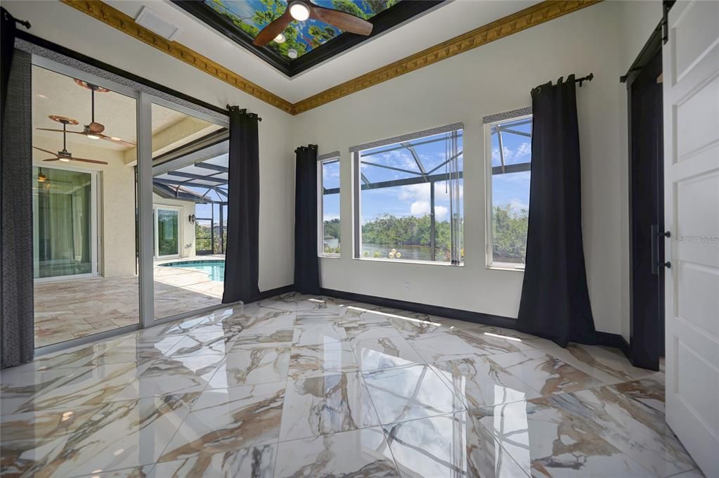 Lustrous marble flooring in this home's second primary suite.