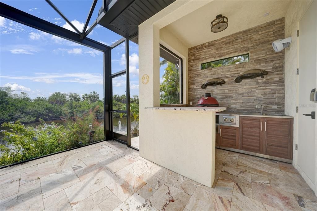 The outdoor kitchen is perfect for an alfresco meal.