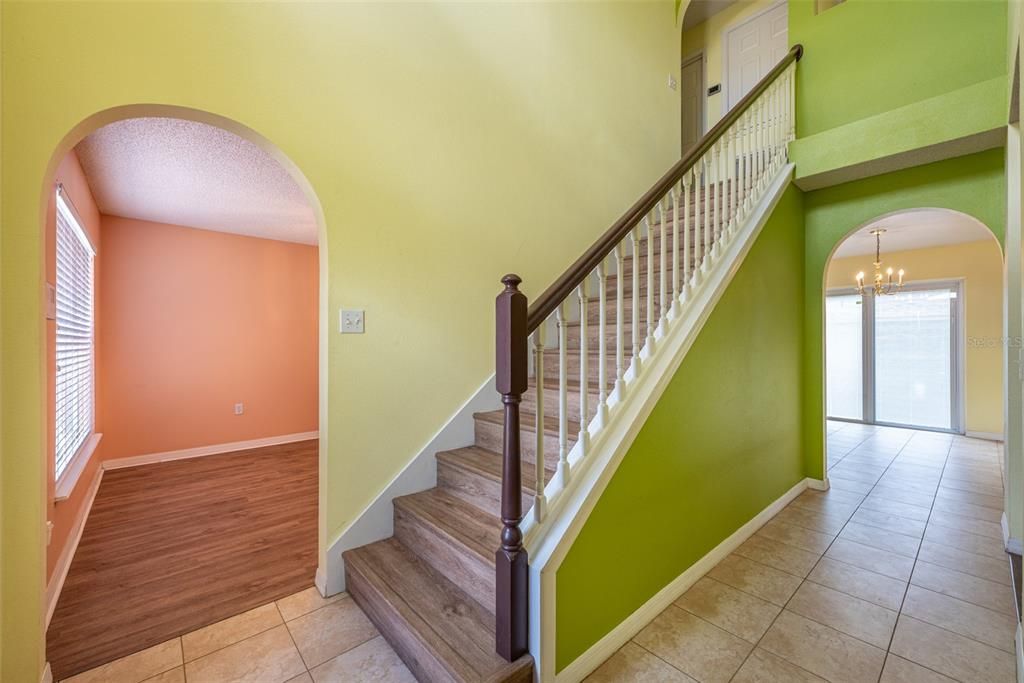 Through arched doorways you will discover a Dining room, Living room, Study/Den/Office, and a spacious kitchen and half bathroom on the first level.