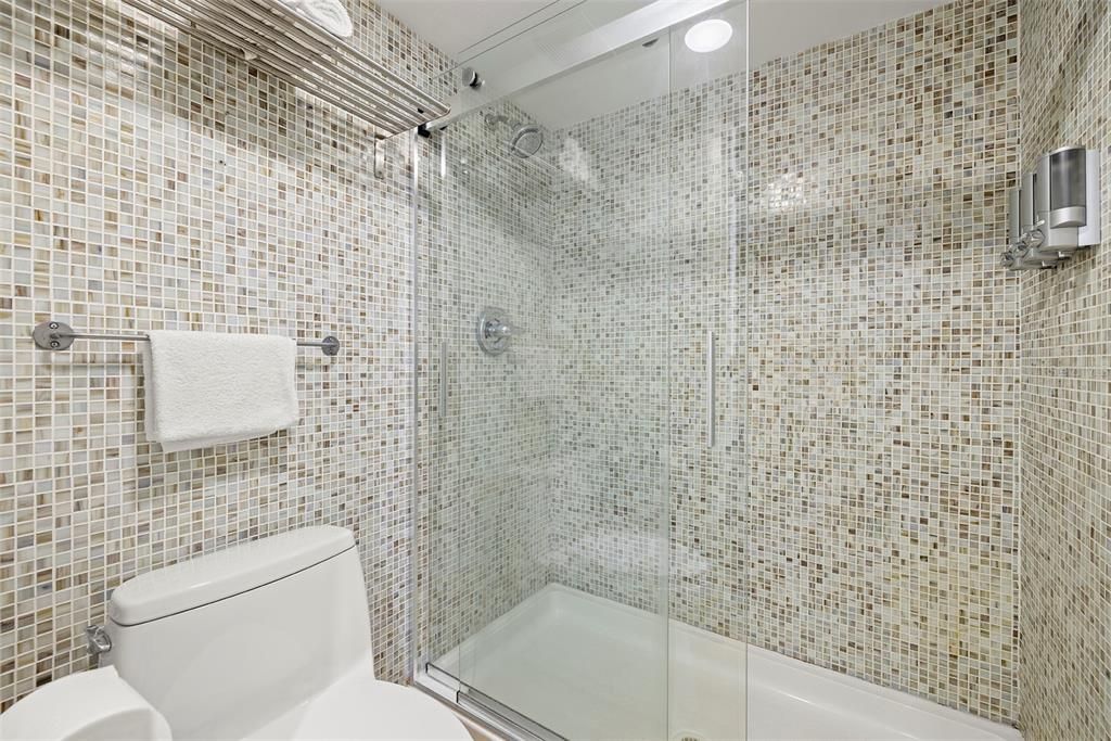 Master bathroom with a tub