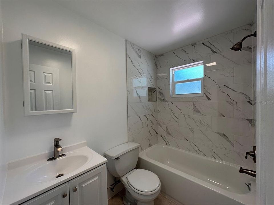 Bathroom with shower and tub