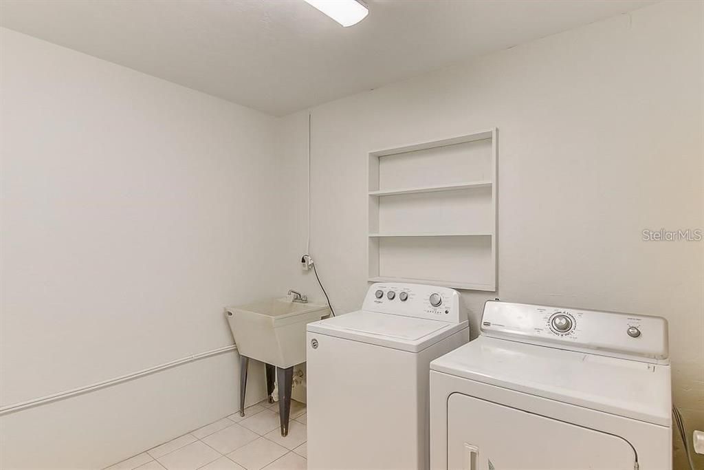 Very spacious 9' x 9' laundry and storage room