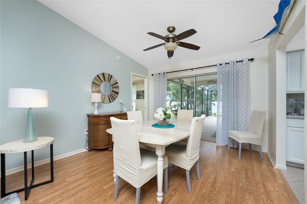 Dining area has beautiful laminate flooring.