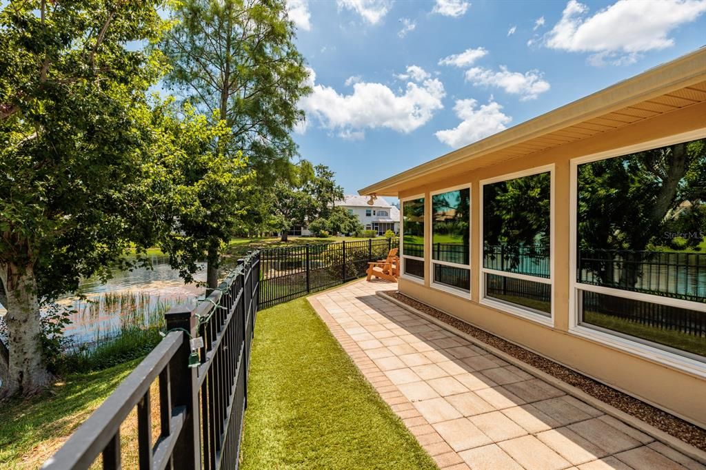 FAMILY ROOM OVERLOOKING THE POND.