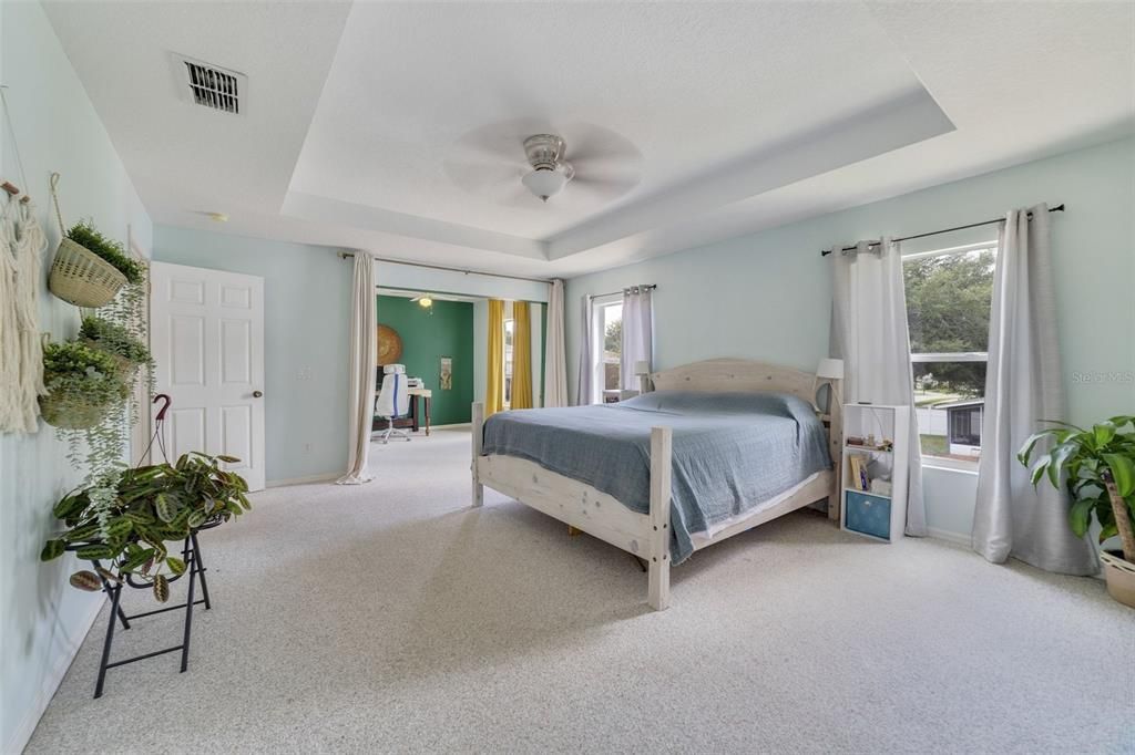 Primary ensuite with tray ceiling has versatile bonus space