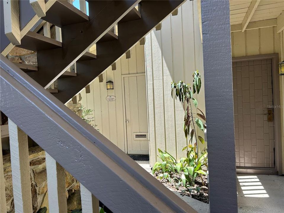 At the bottom of the steps, look left. That is the laundry conveniently located for residents of this building to use ! No more carting wash to the laundry mat !!