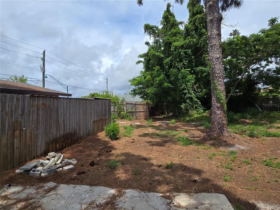 Side yard showing it partially fenced off