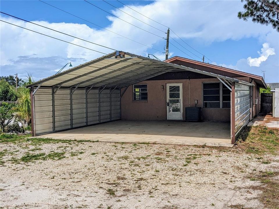 Metal Carport leads into home, installed and permitted 11/27/2018