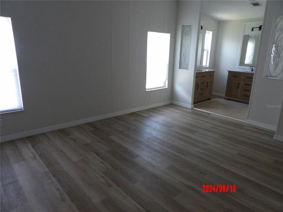 Primary Bedroom going into remodeled bathroom