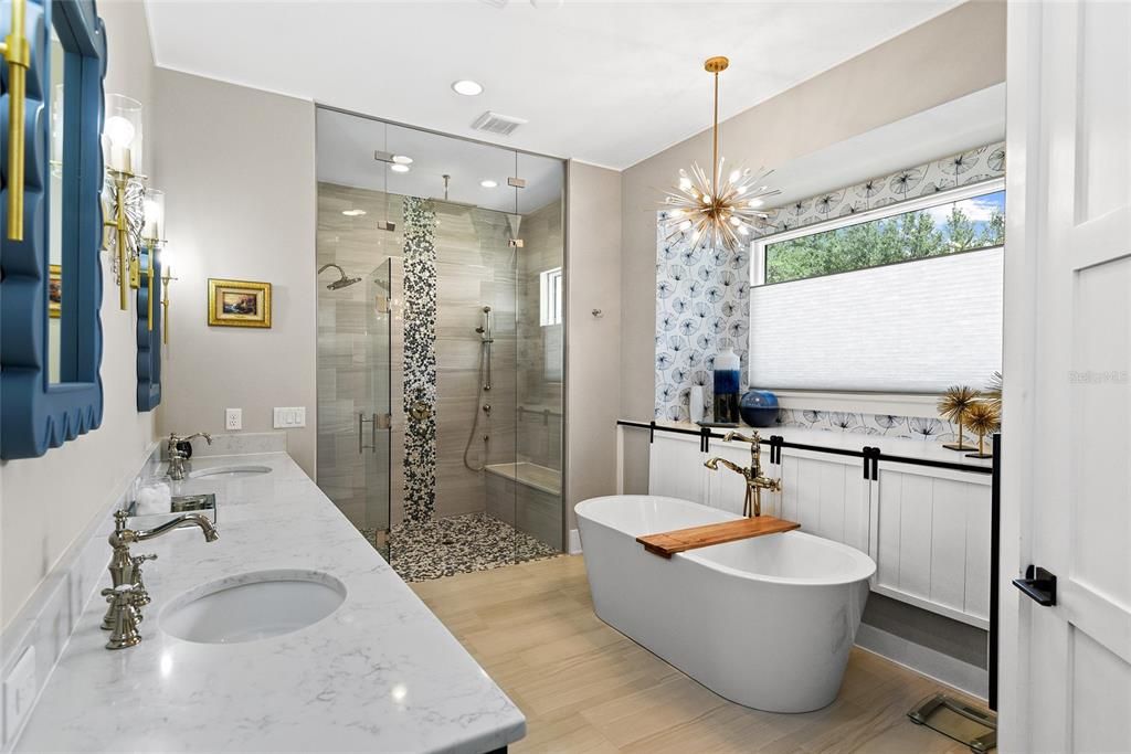 The spa-inspired primary bath offers double sinks and custom cabinetry