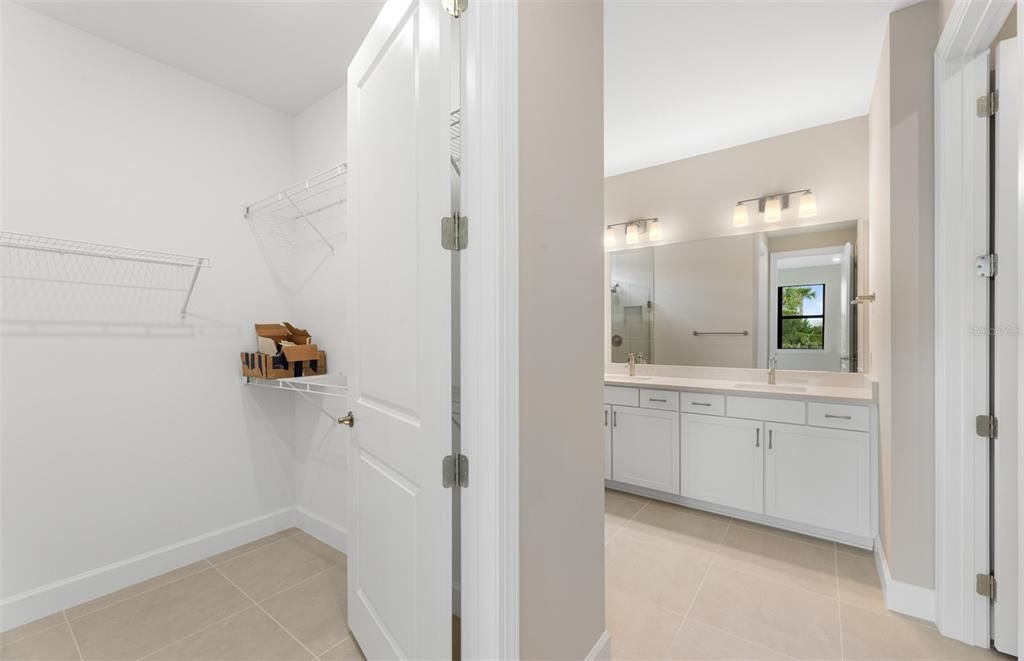 Spacious walk-in closet for master bedroom.