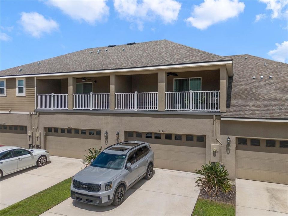 Covered balcony and rear entry 2 car garage