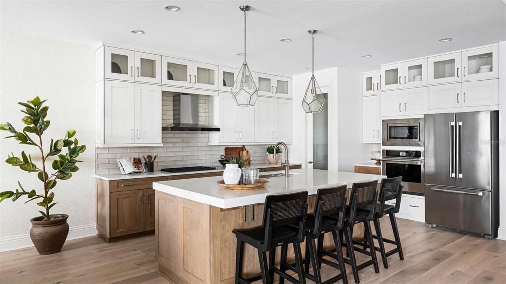 Your gorgeous, Chef's kitchen with JennAir appliances, Caeserstone quartz countertops, and soft-close cabinets and drawers