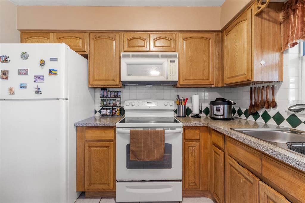 WOOD CABINETS AND        BACK SPLASH