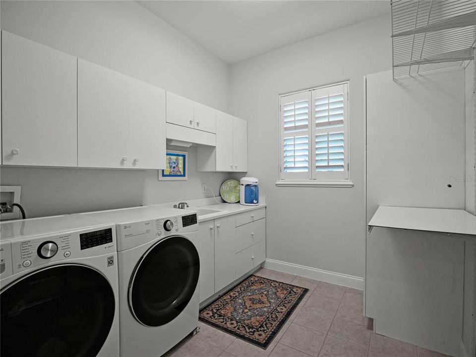 Laundry room located off the garage entrance