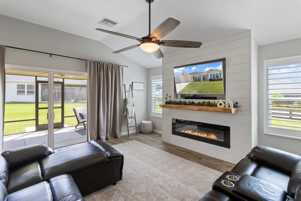 Double Slider in Living Room opens to the Covered, Screened Lanai