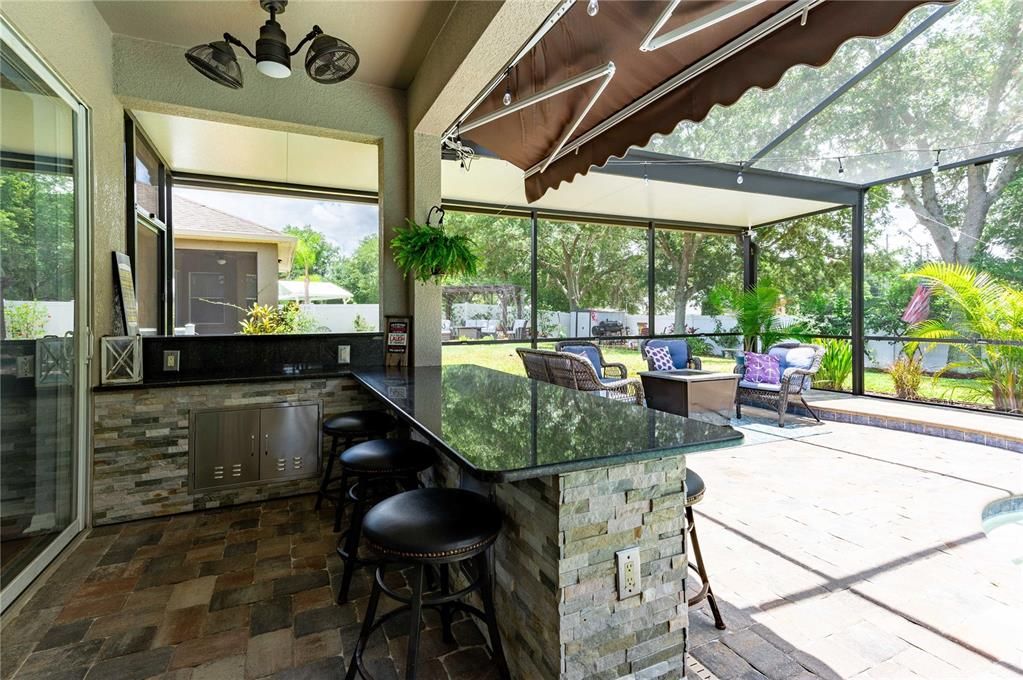 Outdoor Dining Area with granite countertops