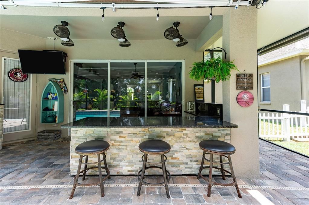 Outdoor Dining Area with granite countertops