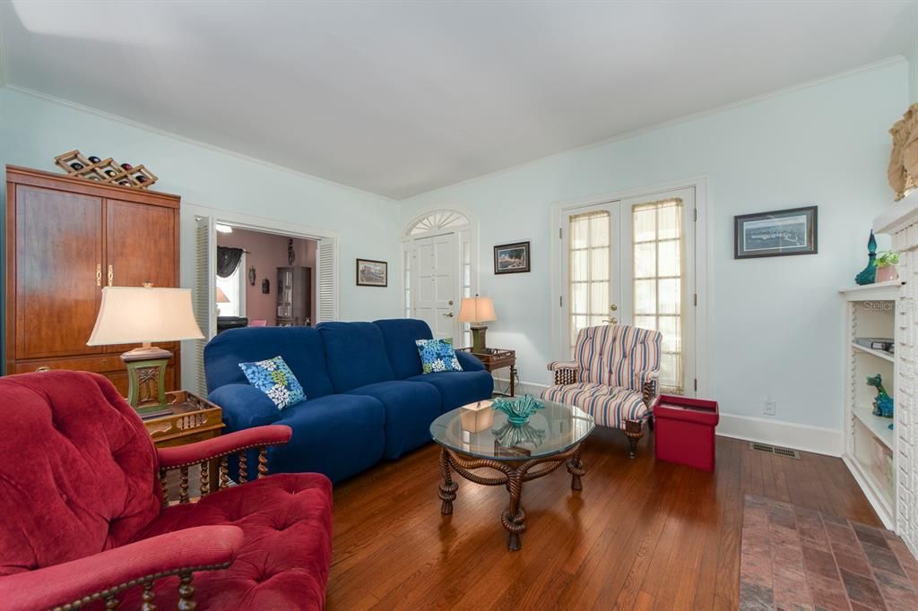 Entrance and living area on first floor and entrance to lower front bedroom/office