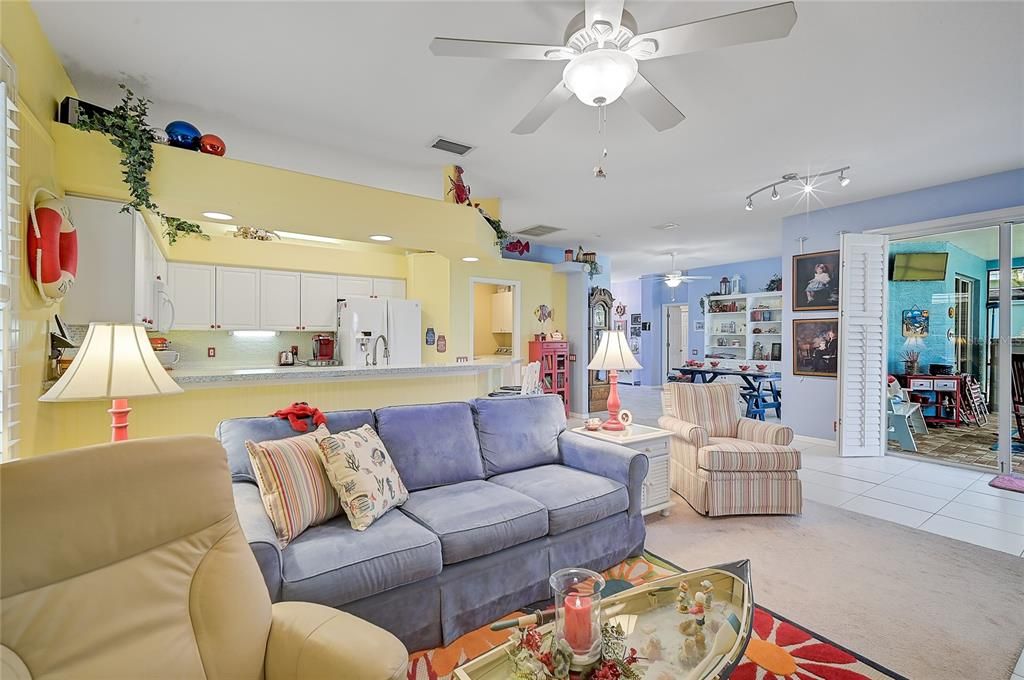 Family room is open to the kitchen; Slider provides another entry to lanai and pool.