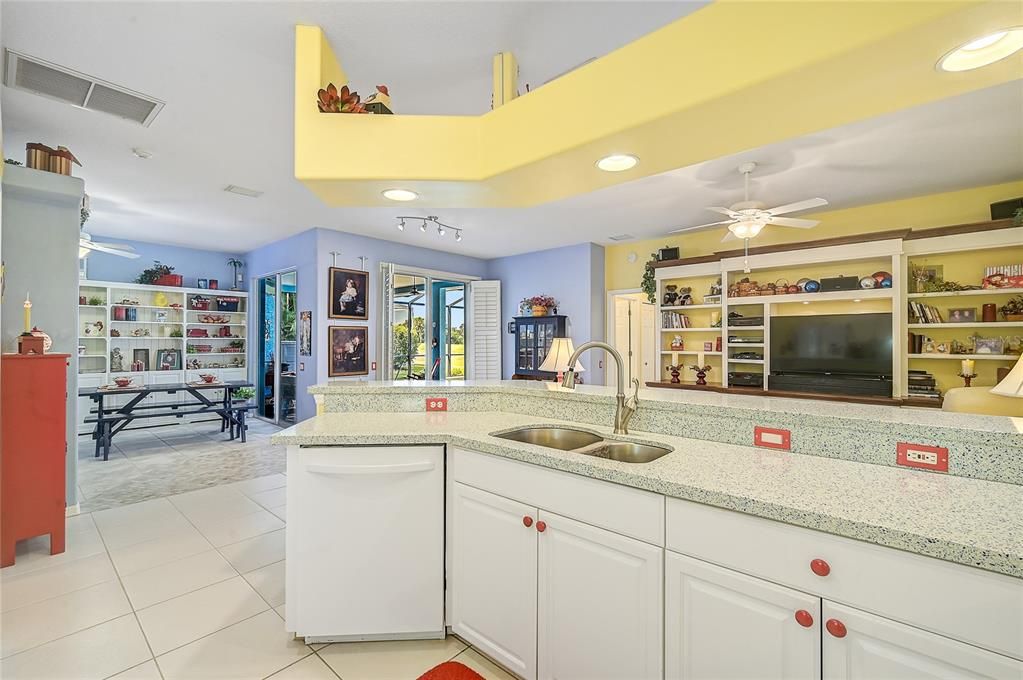 Beautiful light and bright kitchen, sliders to the right have full size plantation shutter doors, beautiful built-in wall unit with space for large television