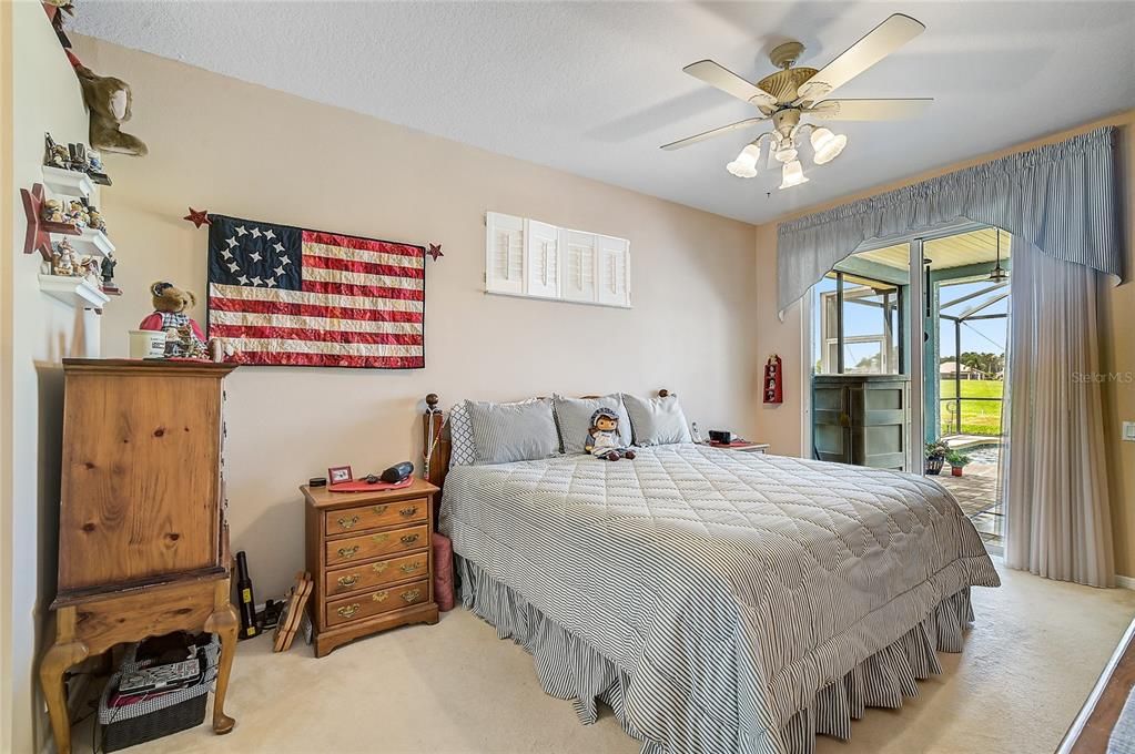 Master bedroom has sliding door to the lanai and pool. Wake up to a beautiful golf course view