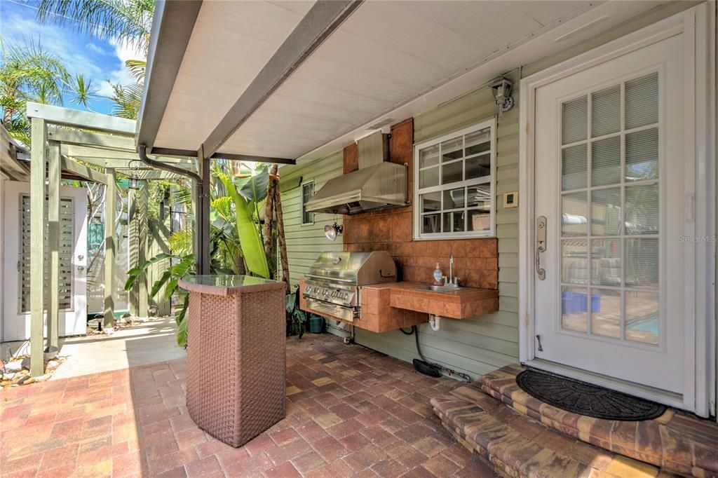 barbecue, sink and bar area at back door