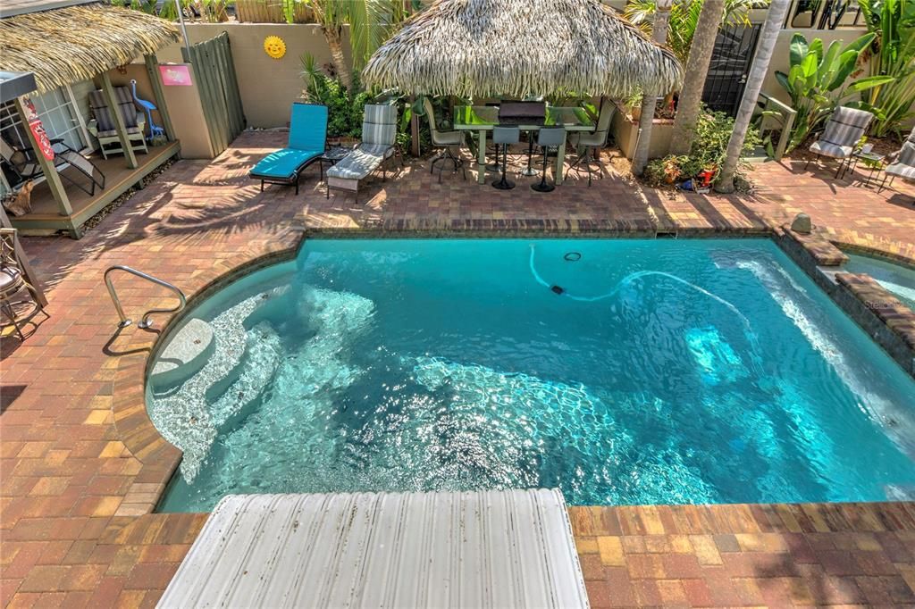 view of pool from upstairs porch