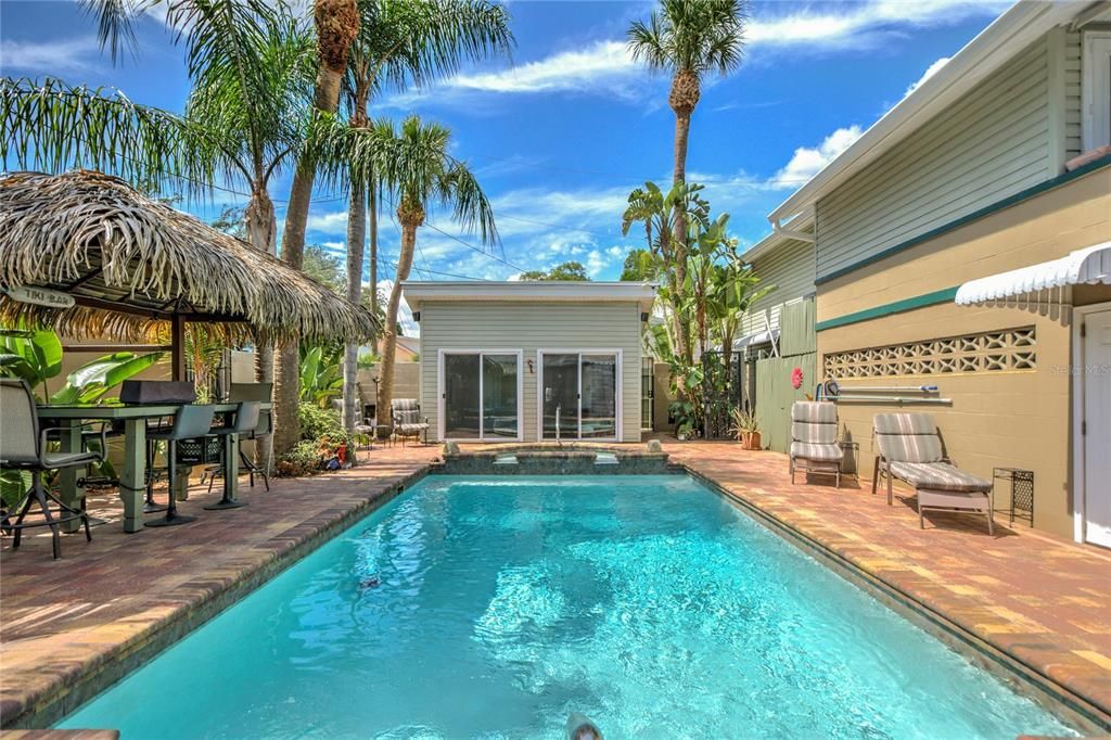 view of pool and party cave, Tiki Hut off to left