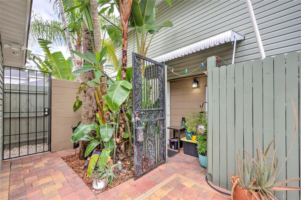 entrance gate from back parking area and entrance to 1 bedroom unit