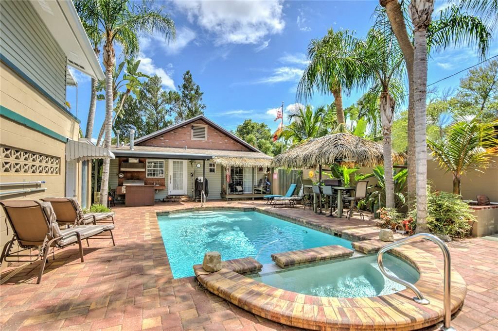 pool and yard viewed from back exit gate