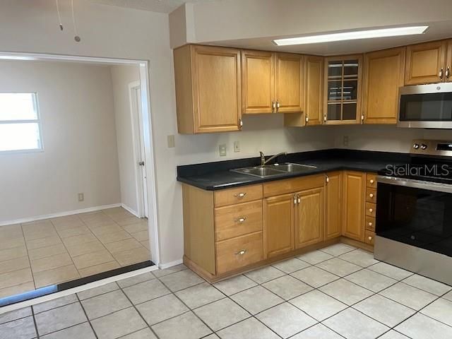 Kitchen shows breakfast nook/office