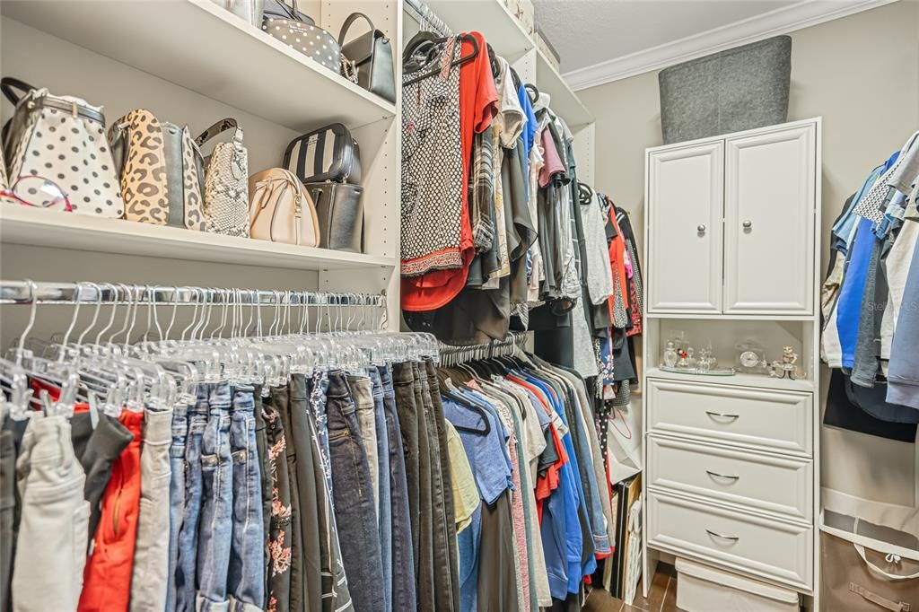 Primary bedroom closet with built ins