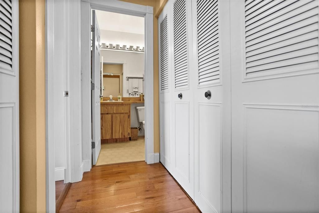 Hallway to bedroom 2, guest bathroom and laundry closet