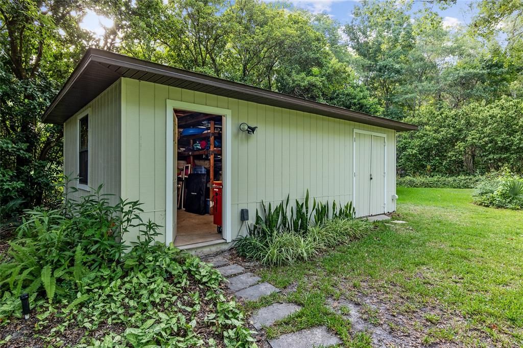 Enclosed storage shed with electricity