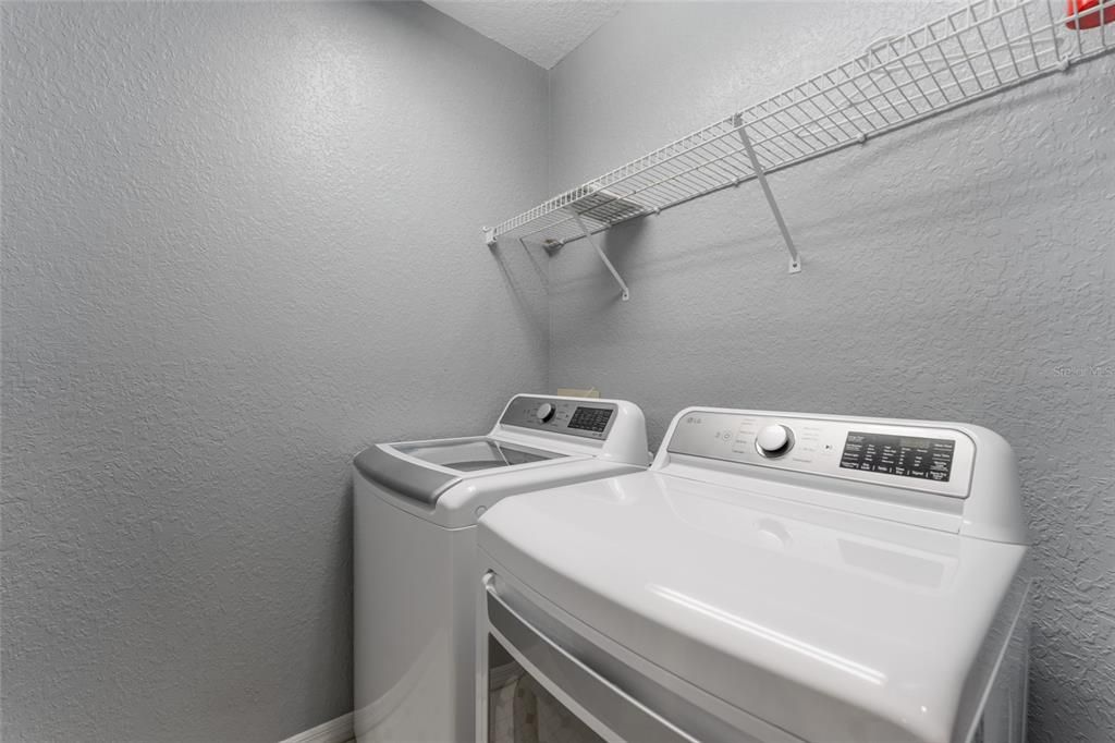 upstairs laundry with new washer and dryer