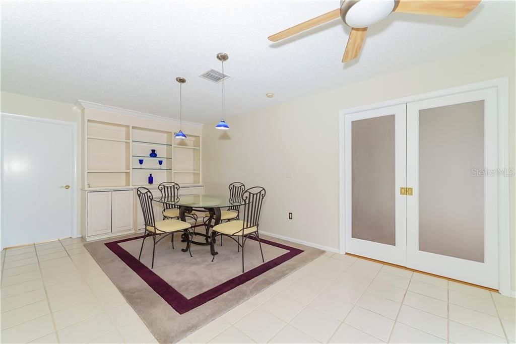 Large dining room with built-ins.  Dining room furniture can stay or go