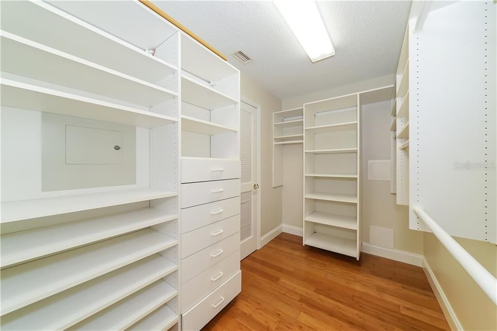 Built ins in the large walk in master closet