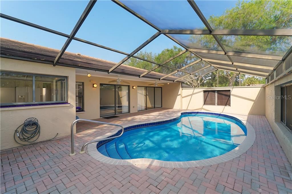 VERY PRIVATE caged/screened courtyard pool.  This is a newer pool