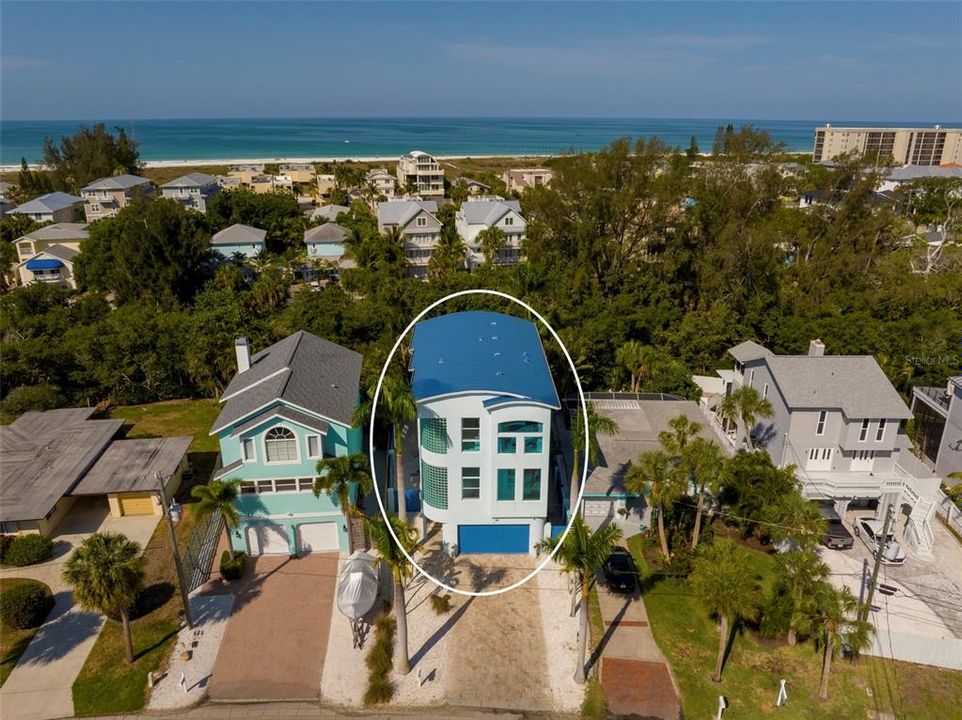 On beautiful Palm Island in the heart of Siesta Key and just 2 blocks from world famous Siesta Key Beach, you'll find this fantastic modern island waterfront home.