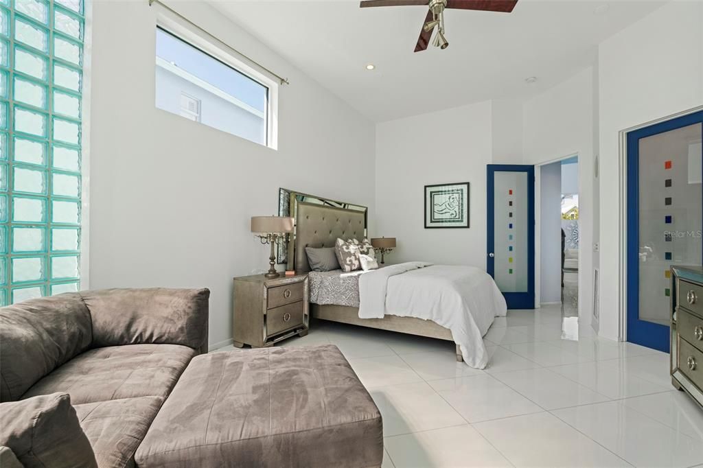 Relax in the private owner's suite bathed in light through the glass block wall feature and luxuriate in the owners spa-like bath with jetted tub, gorgeous granite counters, etched glass, and Toto toilet system.