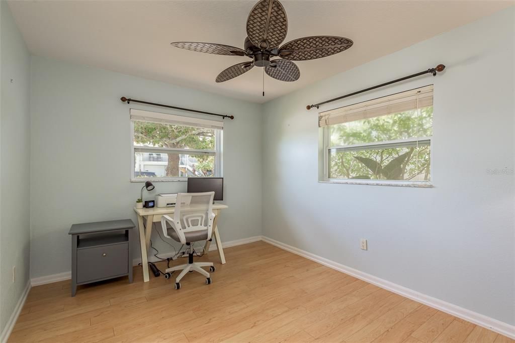 Bedroom 2 exudes a light and airy ambiance, accentuated by its built-in closet, creating a serene and organized space for relaxation and rejuvenation.