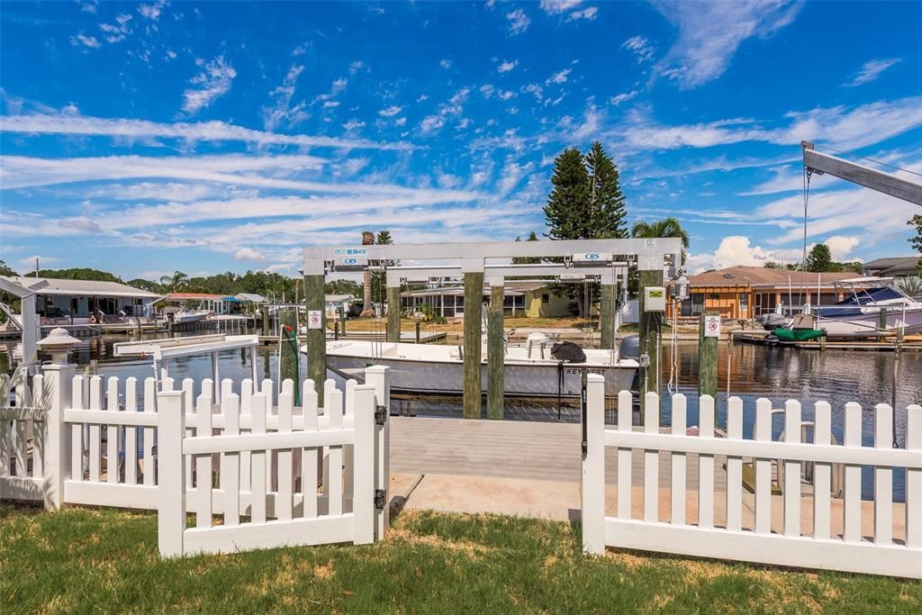 Step through the doorway to a boater's dream—a sprawling dock equipped with two davits, offering unparalleled access to the waterways for endless adventures and maritime enjoyment.